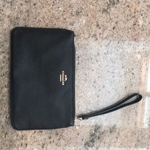 Black and gold coach wristlet